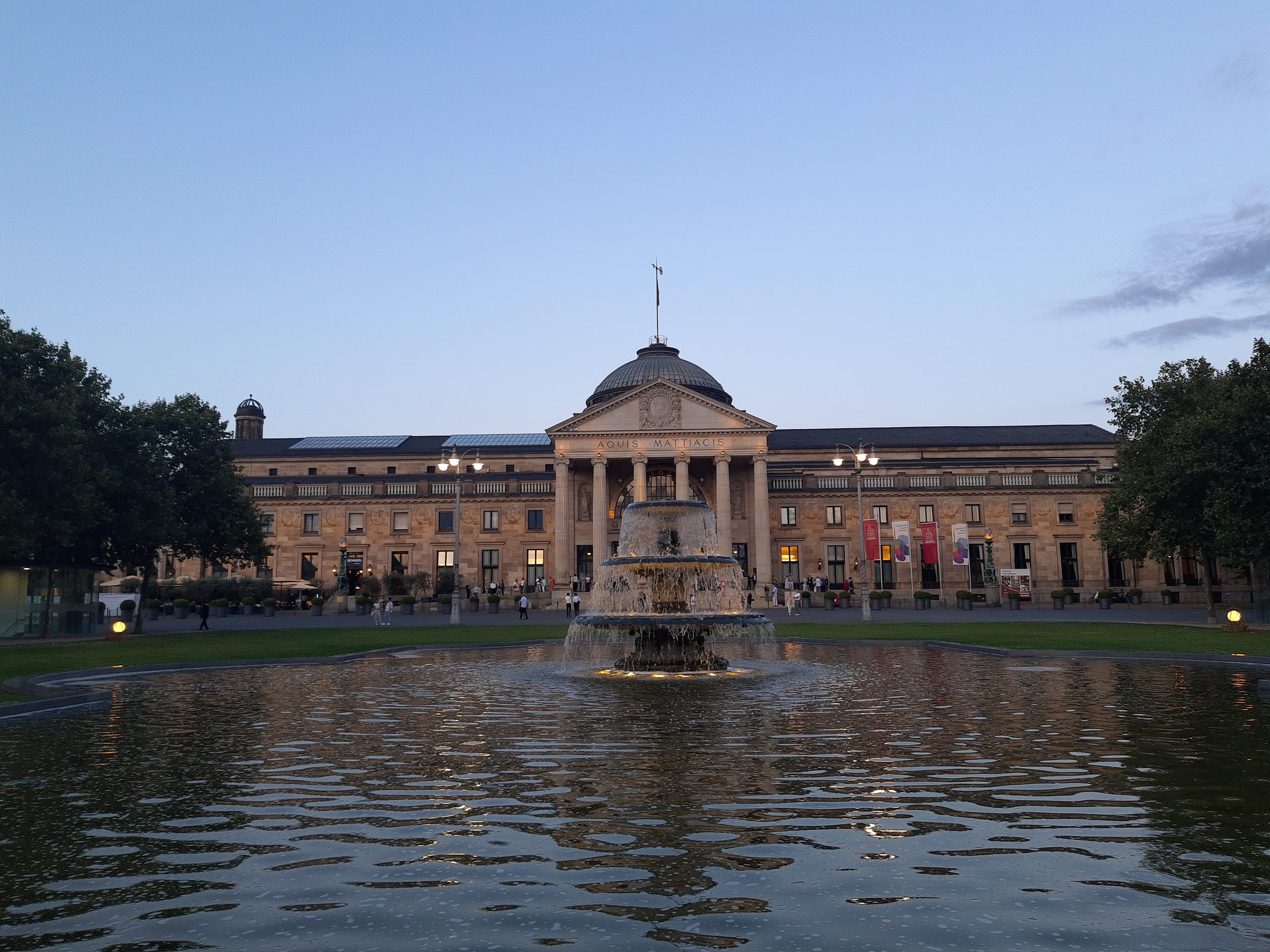 The Kurhaus Wiesbaden across the pool on the Bowling Green, against a blue sky